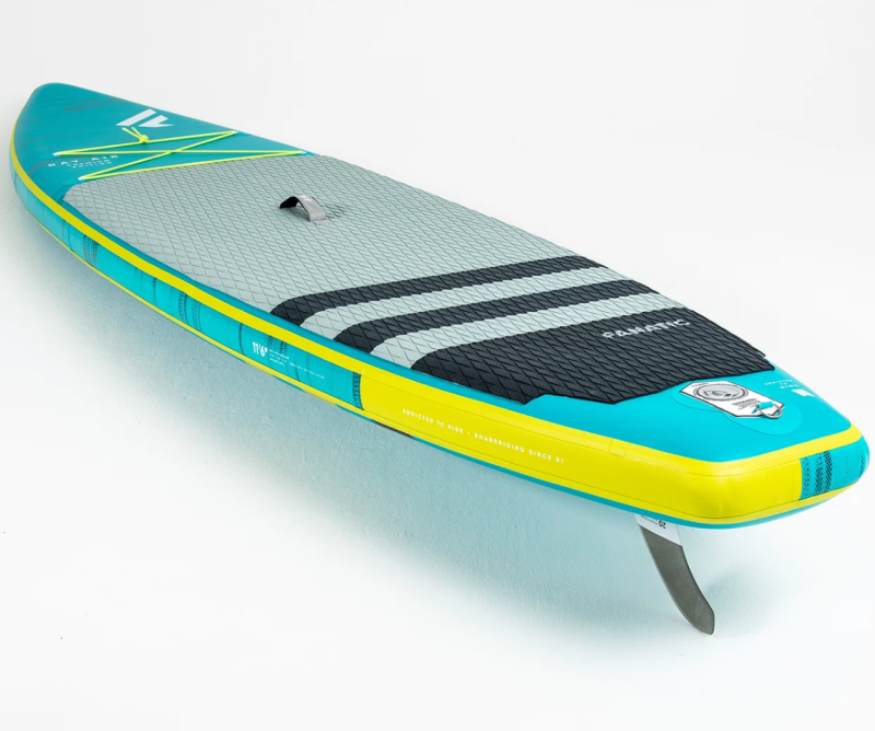 3/4 rear view of the Ray Air Premium inflatable stand up paddle board with fin