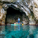 Ray Air Premium inflatable sup with rider at mouth of cave on water