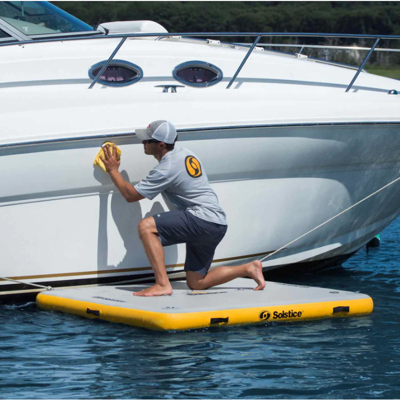 Solstice inflatable dock 6x5 being used for boat maintenance