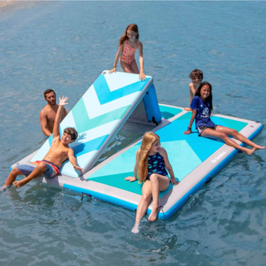 Kids playing on Solstice inflatable slide dock