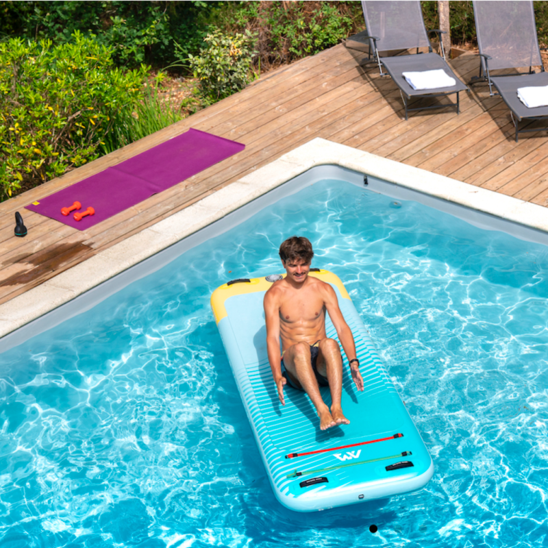 Guy doing core exercises on his PEACE Inflatable platform by Aqua Marina , in swimming pool